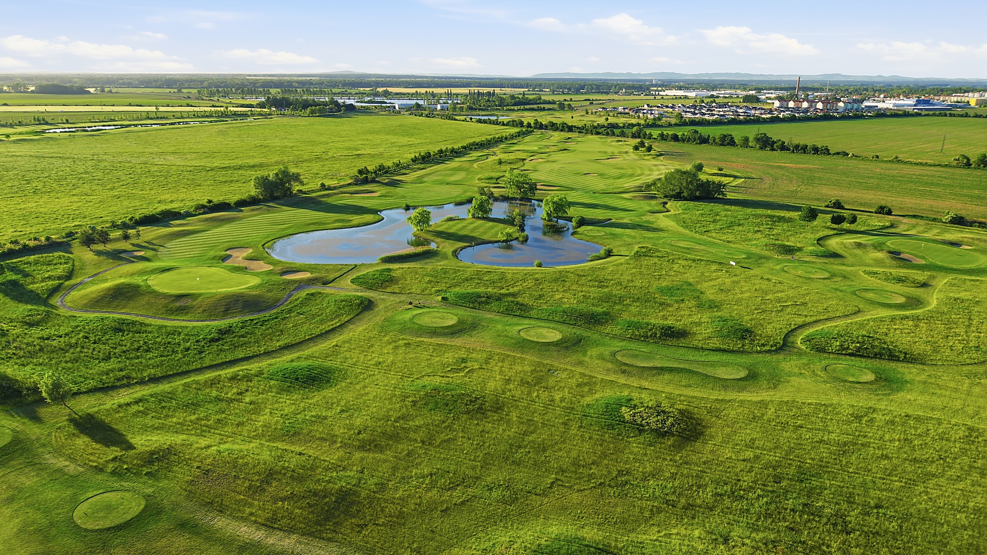 GRAFOBAL GROUP GOLF RESORT, hole with lake from the drone